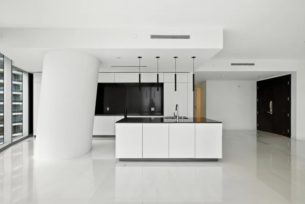 Photo of a luxury condo at the Aston Martin building in downtown Miami Showing living area and kitchen. Photo taken by Golden Pixxel Media.