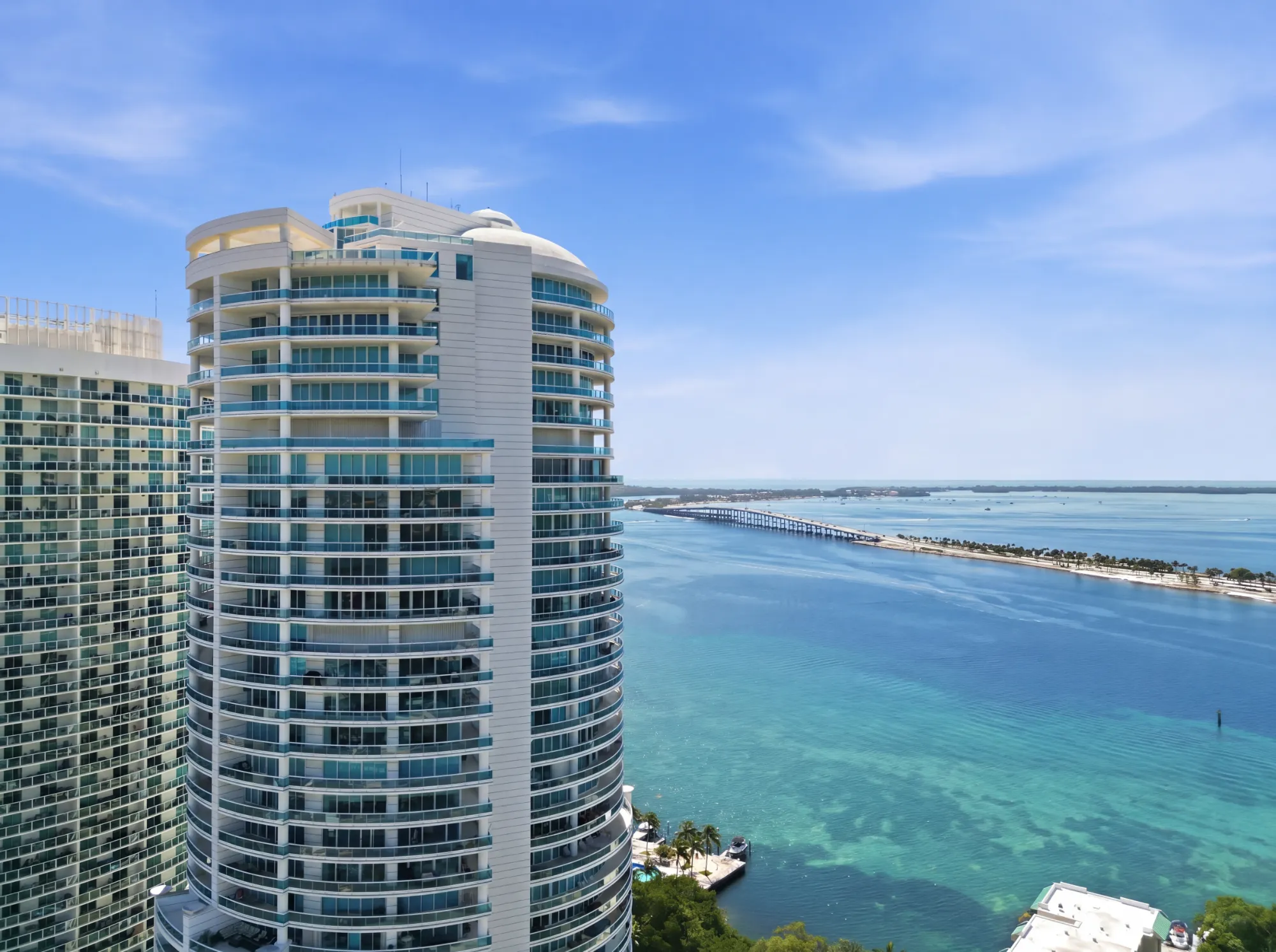 Photo of a luxury condo at the Aston Martin building in downtown Miami Showing living area and kitchen. Photo taken by Golden Pixxel Media.