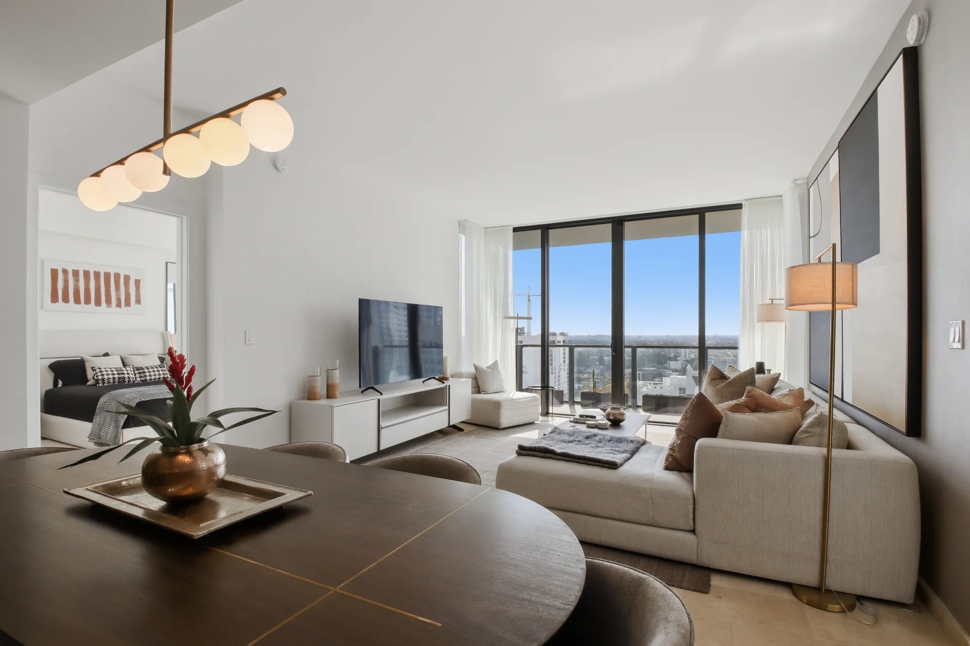 Photo of a luxury condo at the Aston Martin building in downtown Miami Showing living area and kitchen. Photo taken by Golden Pixxel Media.
